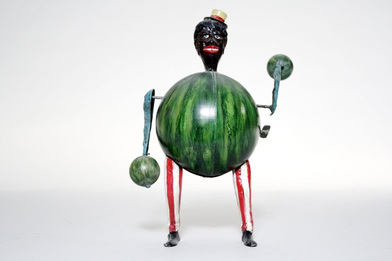 Juggling Watermelon Boy: Probably Gunthermann • German – Circa 1905 We have not seen this unusual character before. Certainly German and made circa 1905. He works well. Material: Tin