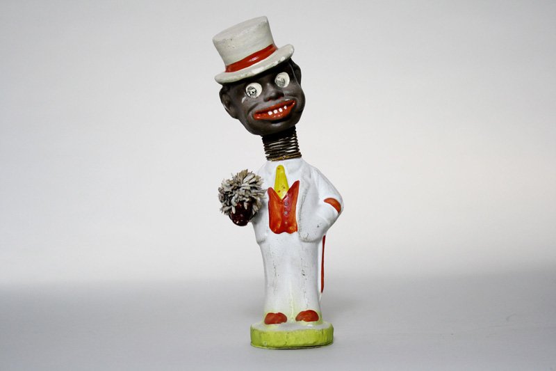 Articulated Black Dandy Nodder: German – Circa 1920 He depicts a young black man on his way to meet his gal. He is 7 ½” tall. Material: Composition