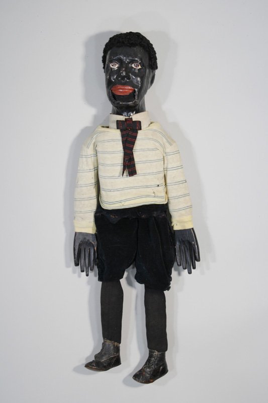 Black Ventriloquists Dummy: American – Circa 1890 Similar to a pair of ventriloquist dummies sold (lot 460) in RSL’s July 1, 2012 sale. Material: Wood, Composition, Fabric, Leather and Wood