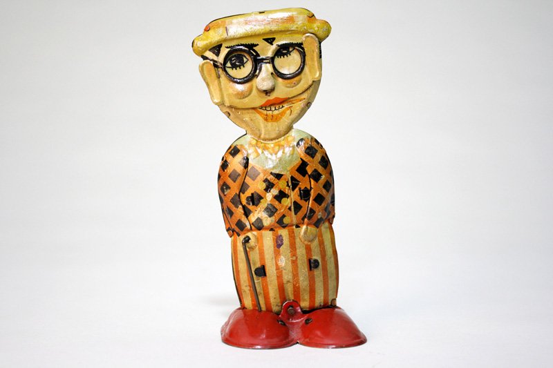 Harold Lloyd Walking Figure Wind Up Toy: Germany – Circa 1920 An iconic image of the famous silent movie star: Harold Lloyd. It is 6 ¾” tall and works well. Material: Lithographed Tin