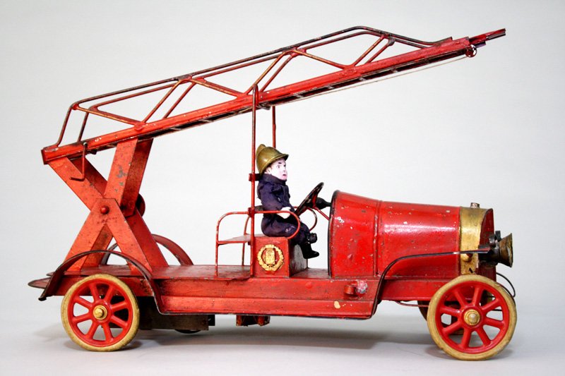 Aerial Hook and Ladder Wind Up Toy: Made by Pinard French – Circa 1915 This is a classic and finely detailed Aerial toy. It is 16” long and works well. Material: Tin