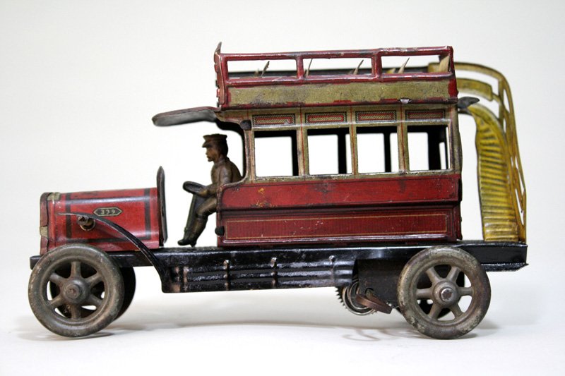 Double Decker Bus Wind Up Toy: Made by Orober Germany – Circa 1915 This is a charming little bus that is 7 ½” long and works well. Material: Tin
