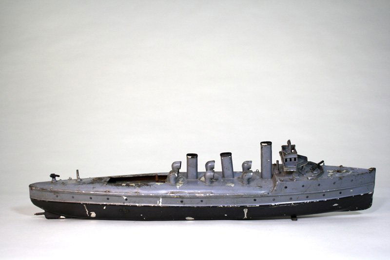 German Gun Boat Wind Up Toy: Gebruder Bing Germany – Circa 1915 This gunboat in “as found” condition is 21” long. Material: Tin