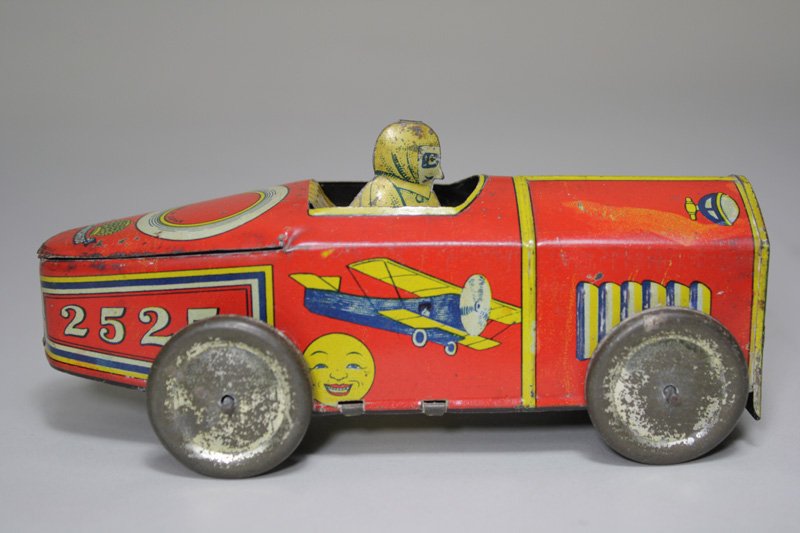 Prewar Japanese Lithographed Racecar Wind Up Toy: Made by Sanshodo Japan – Circa 1925 The lithography on this scarce racecar is truly amazing. The toy is 6 ¼” long. Material: Tin