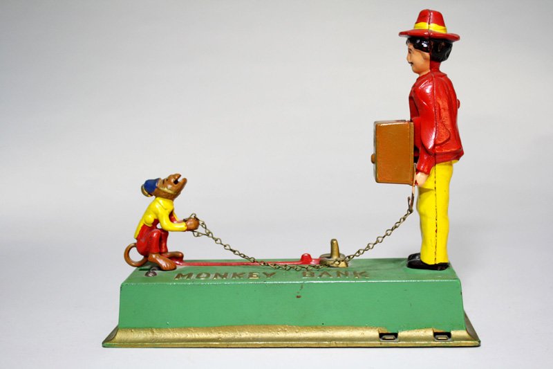 Monkey Bank Mechanical Bank: Made by Hubley Manufacturing Company Lancaster, Pennsylvania – Circa 1930 The monkey springs forward to deposit the coin into the organ grinder’s hurdy-gurdy. Material: Cast Iron