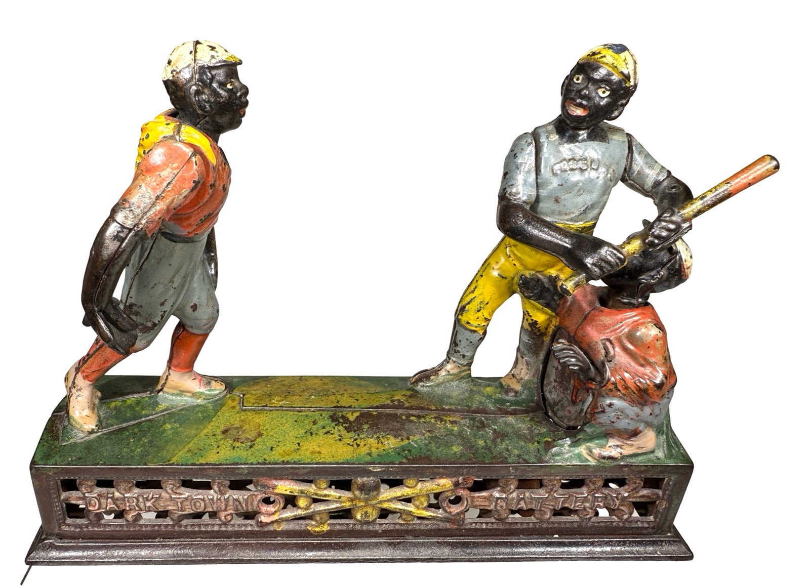 Darktown - Cast Iron Mechanical Bank: Made by J. & E. Stevens Company. Cromwell, Connecticut - Late 1880's. The sporting theme, vivid color and dynamic action make the Darktown Battery one of the great favorites of collectors. Pennies pla