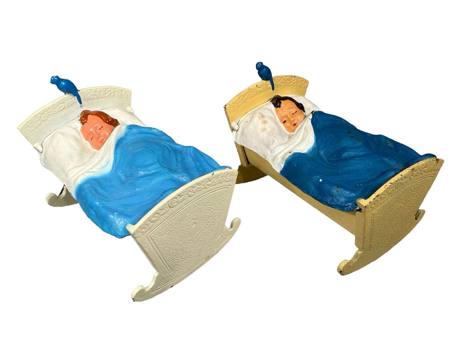 Two Baby in Cradle Still Banks: American - 1960's. 3 3/4" Long. Made of Cast Iron and Tin.