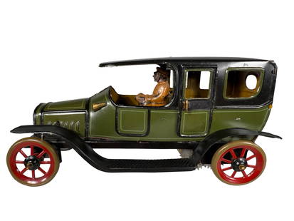 Olive Green & Black Limousine: Made by the Karl Bub Company. Germany - Circa 1920 - 8" Long. Though not large in scale, the simple elegant design of this toy auto is pure perfection. It truly exemplifies, albeit in miniature, what