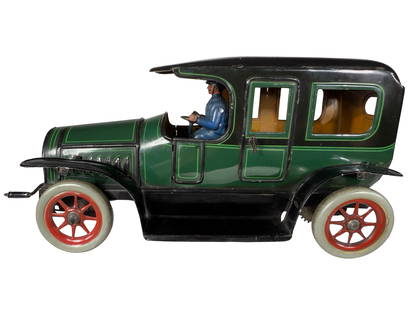 Bright Green & Black Limousine: By the S. Gunthermann Company. Germany - Circa 1925 - 11" Long. The Gunthermann Company was not often involved in the making of toy cars. So their playthings in this collecting category are exceedingl