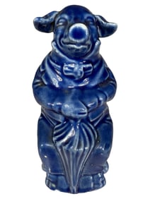 Dressed Pig Seated on Chair with Umbrella Bank