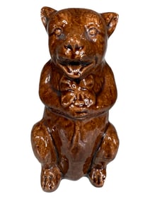 Bear on Haunches Holding Four Leaf Clover Bank