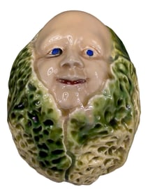Baby Emerging from Cabbage Ceramic Bank