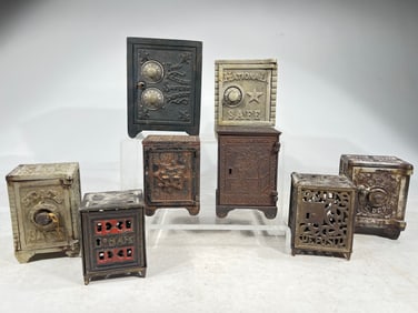 Eight Cast Iron Safe Banks