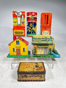 Six Assorted Tin Banks, Varying Sizes