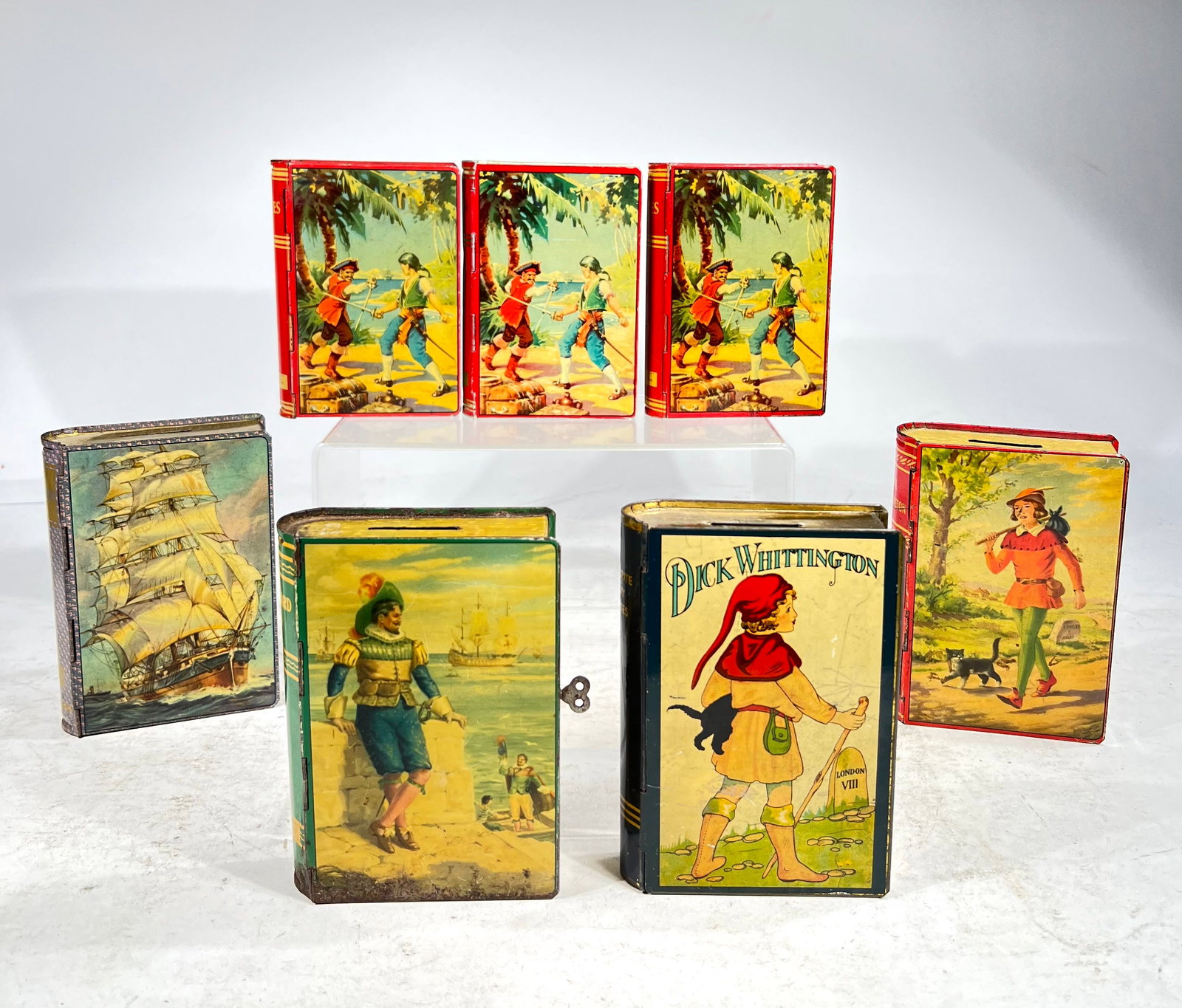 Fourteen Tin Book Banks, Made of Tin: American 1930's, 4"-5 1/2" T