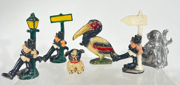 Six Cast Iron Paperweights/Bottle Openers