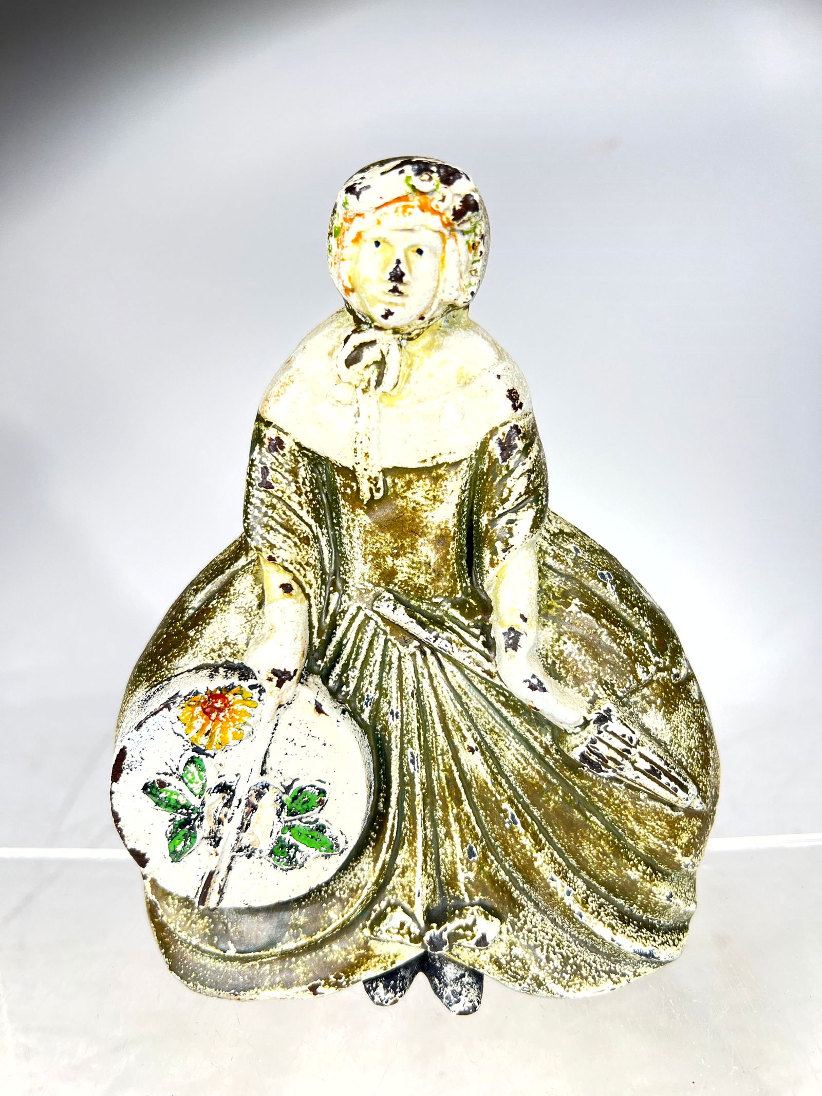 Woman with Hatbox Cast Iron Doorstop: Albany Foundry - Albany, NY. 1930 - 6 3/4"T