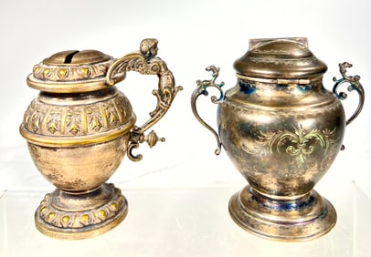 Two Silvered Tin Vase Banks