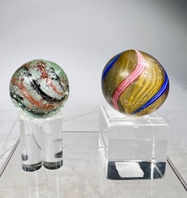 Two Early Hand Blown Swirl Marbles