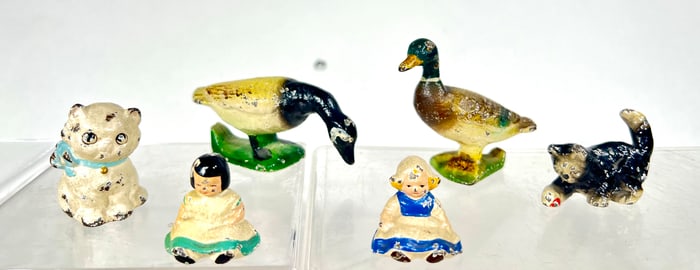Six Cast Iron Paperweights/Bottle Openers