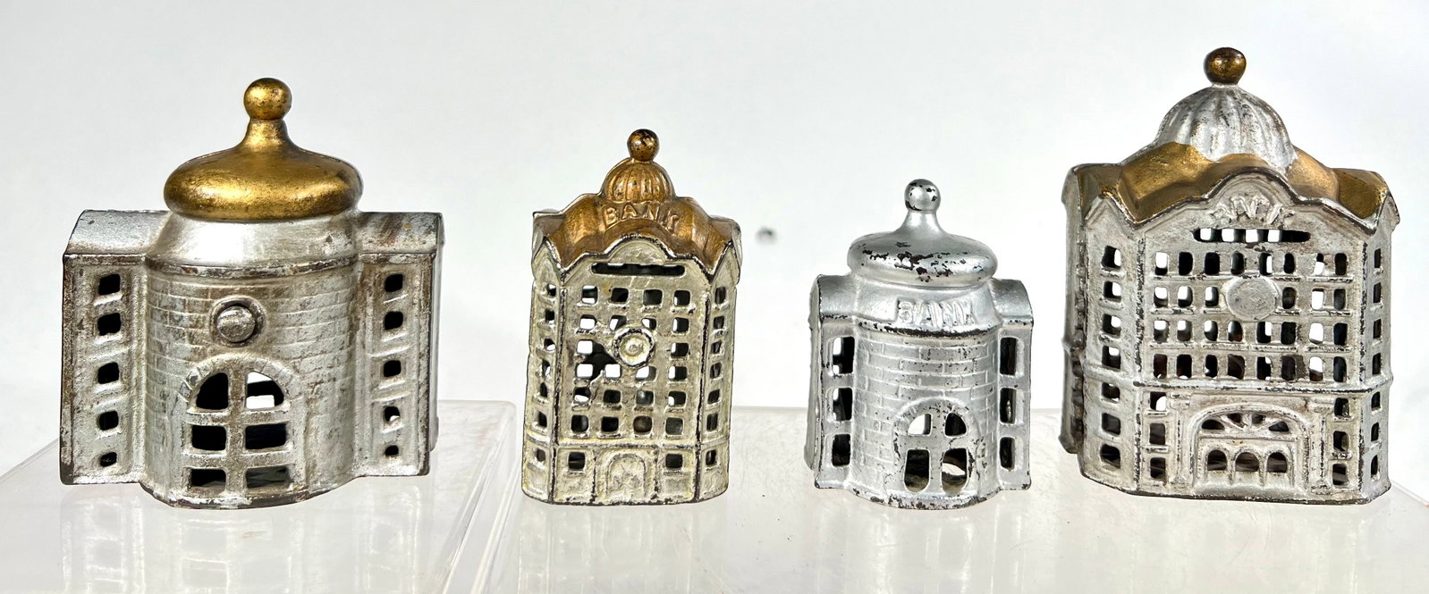 Four Cast iron Building Banks: A.C Williams Co. Ravenna, OH 1920 - 3 1/3" - 4 1/2" T