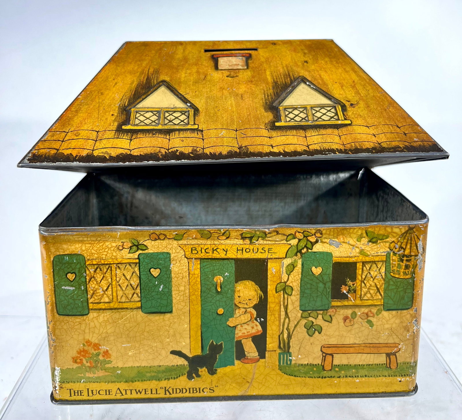 The Lucy Atwell "Kiddies" Bank Made of Tin: William Crawford & Sons Biscuit Manufacturers, English 1930 - 8" L x 7 1/4" T