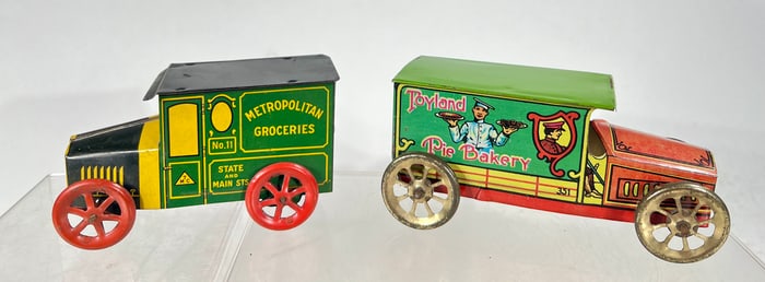 Two Hand Operated Tin Trucks