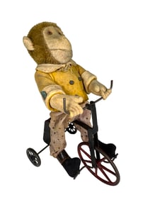 Monkey Riding a Tricycle