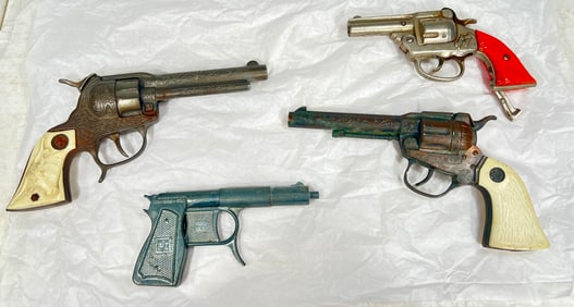 Three Cap Guns & One Spud Gun