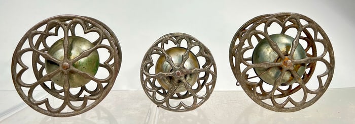 Three Bell Toys between Wheels