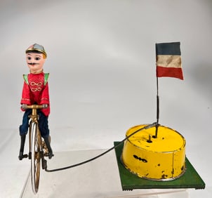 Man Riding a High Wheel Bicycle