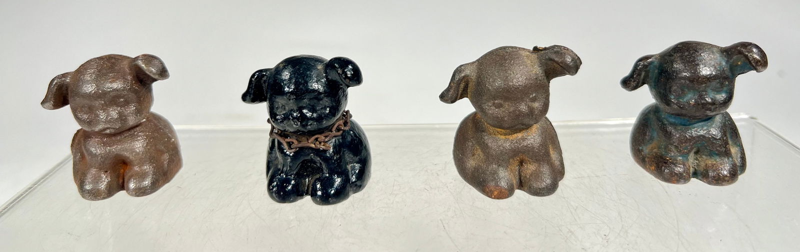 Four Puppo Paperweights: American 1930s - 1” T x 1” W x 1” D