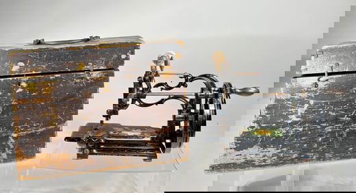 Handcranked Cast Iron Sewing Machine with Floral Decoration