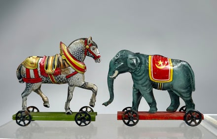 Two Tin Toys on Platform