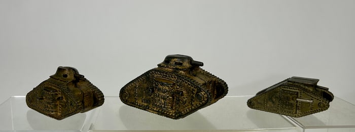 Three Cast Iron Tank Banks