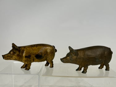 Two Large Cast Iron Pig Banks