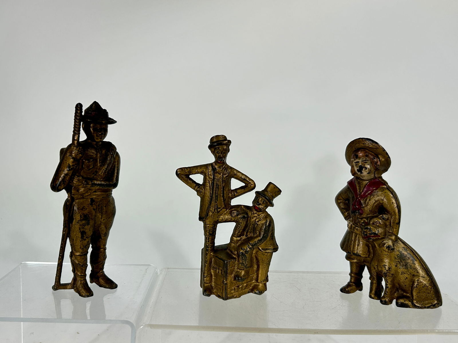 Three Cast Iron Banks - Boyscout, Mutt and Jeff, Buster Brown (1 of 2)