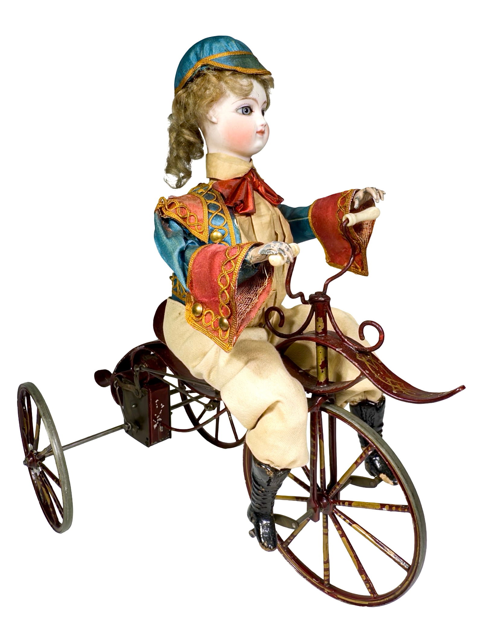 Young Man Riding an Elaborate Tricycle - Wind Up Toy: French - Circa 1890. 11" L x 13" T x 6 1/2' D. This is an impressive, large scaled early French clockwork tricycle. It is in superior condition. It is presently not working.