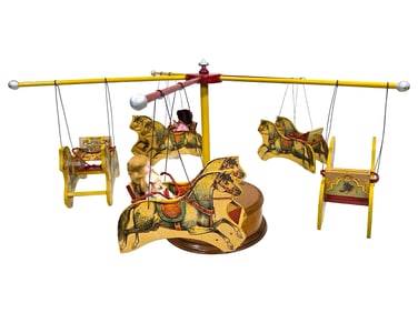 Mechanical Paper Lithographed Carousel with Gondolas Resembling Horse Chairs