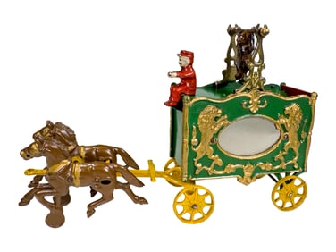 Royal Circus Mirror Van with a Turnable Acrobat  - Cast Iron Toy