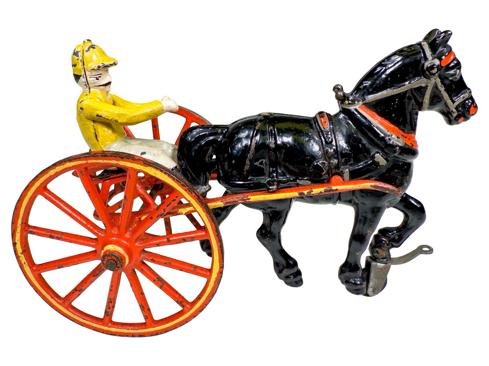 Unusual Sulky with Draft Horse and a Colorfully Costumed Jockey - Cast Iron Toy: Made by the Pratt & Letchworth Company. Buffalo, New York - Circa Early 1890's. 7 3/4" L x 5" T x 3 1/2" D. Here we find another magnificent sulky toy. However, for some inexplicable reason, Pratt & L