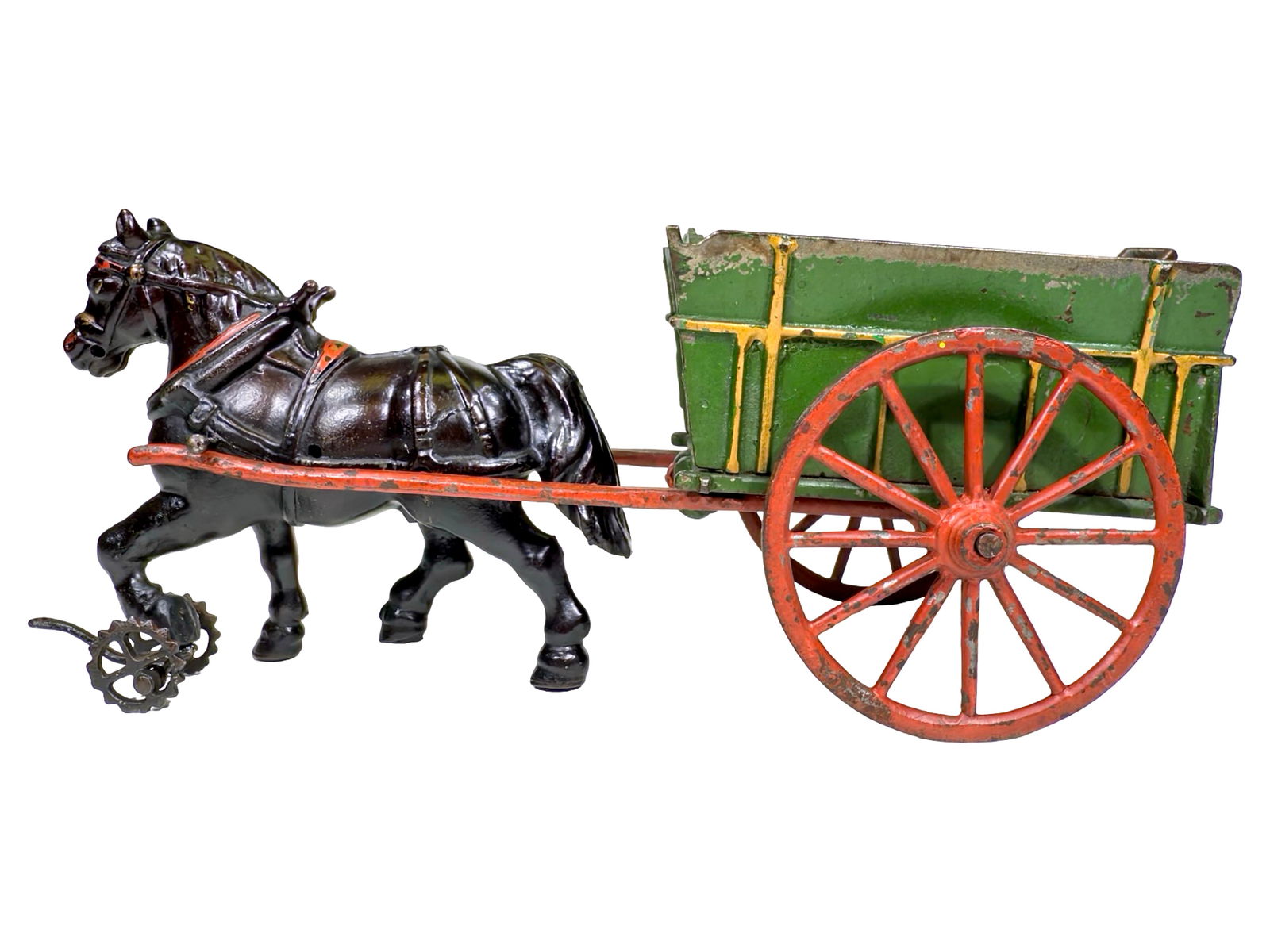 Small Green Coal Cart - Very Scarce - Cast Iron Toy: Made by the Welker & Crosby Company. Brooklyn, New York - Circa Late 1880's. 11 1/2" L x 5 1/2" T x 4 1/2" D. Here, we find another attractive small scaled toy painted green and red. We also witness t