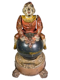 Clown on Globe Cast Iron Mechanical Bank