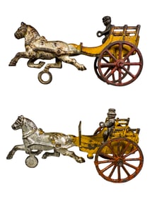 Two Small Cast Iron Horse Drawn Road Carts