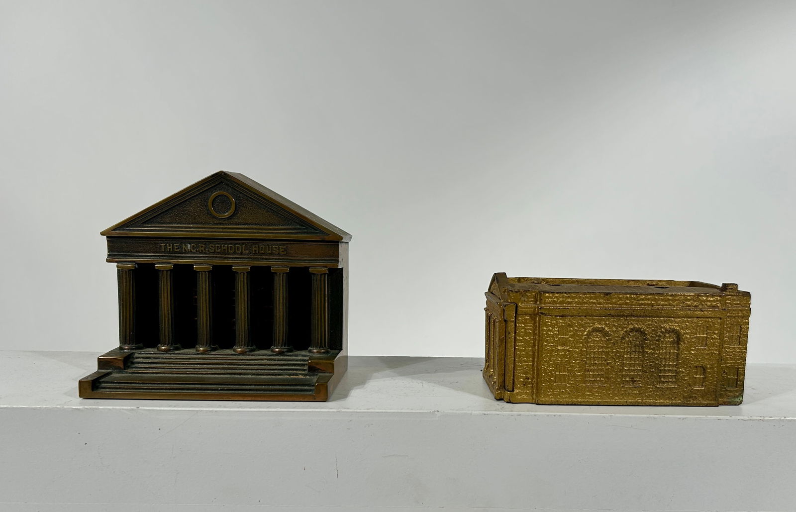 N.C.R. School House Presentation Piece and a Harleysville Bank - One Brass and One Cast Iron (1 of 3)