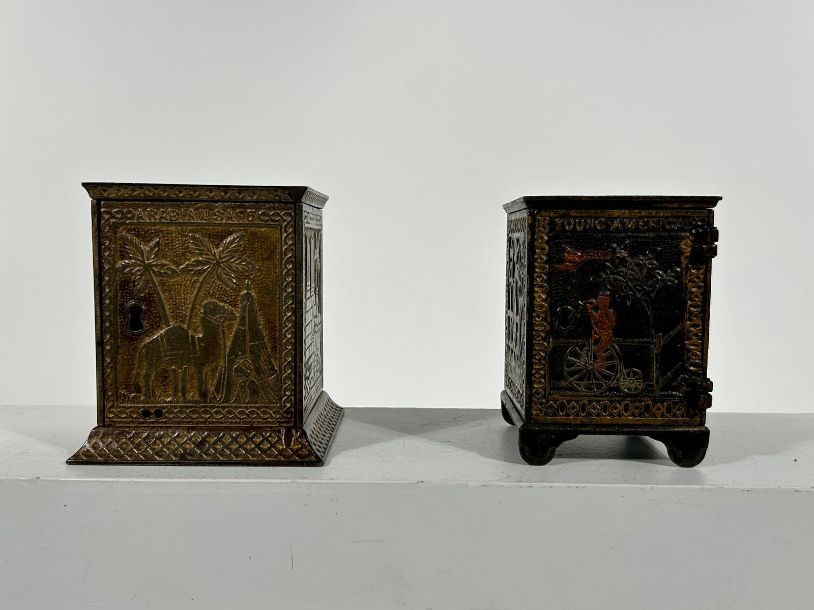 Young American / Arabian Cast Iron Safe Banks - KLT: Kyser and Rex Company - Philadelphia 1890 - Each about 4 1/2"Tall