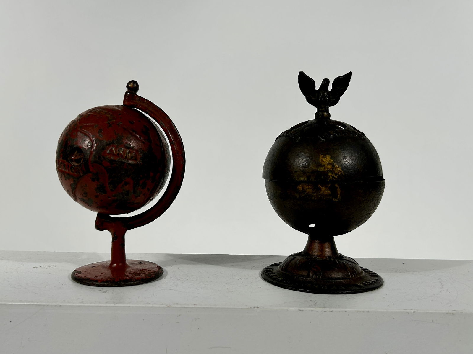 Two Cast Iron Globe Banks: American 1880/1910 - 5 1/2" and 6"Tall Respectively