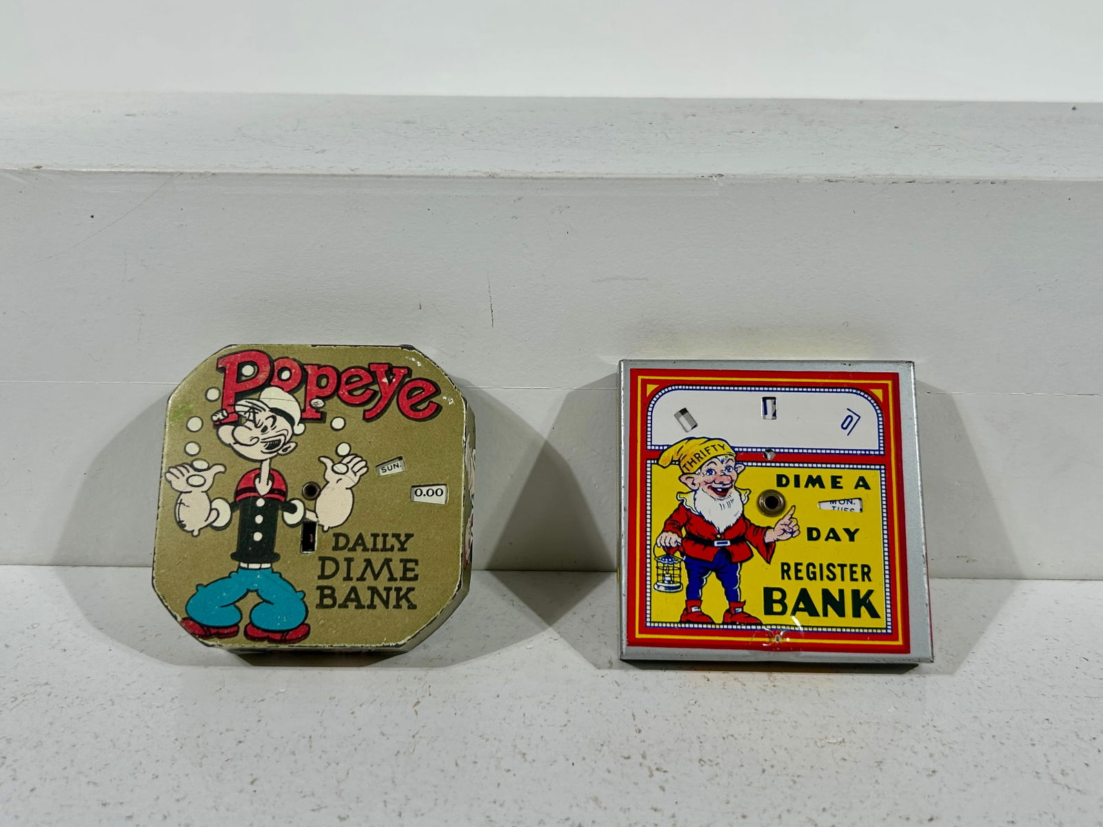 Thrifty Dime and Popeye Tin Pocket Register Banks: American 1930/40's - 2 1/2" Square