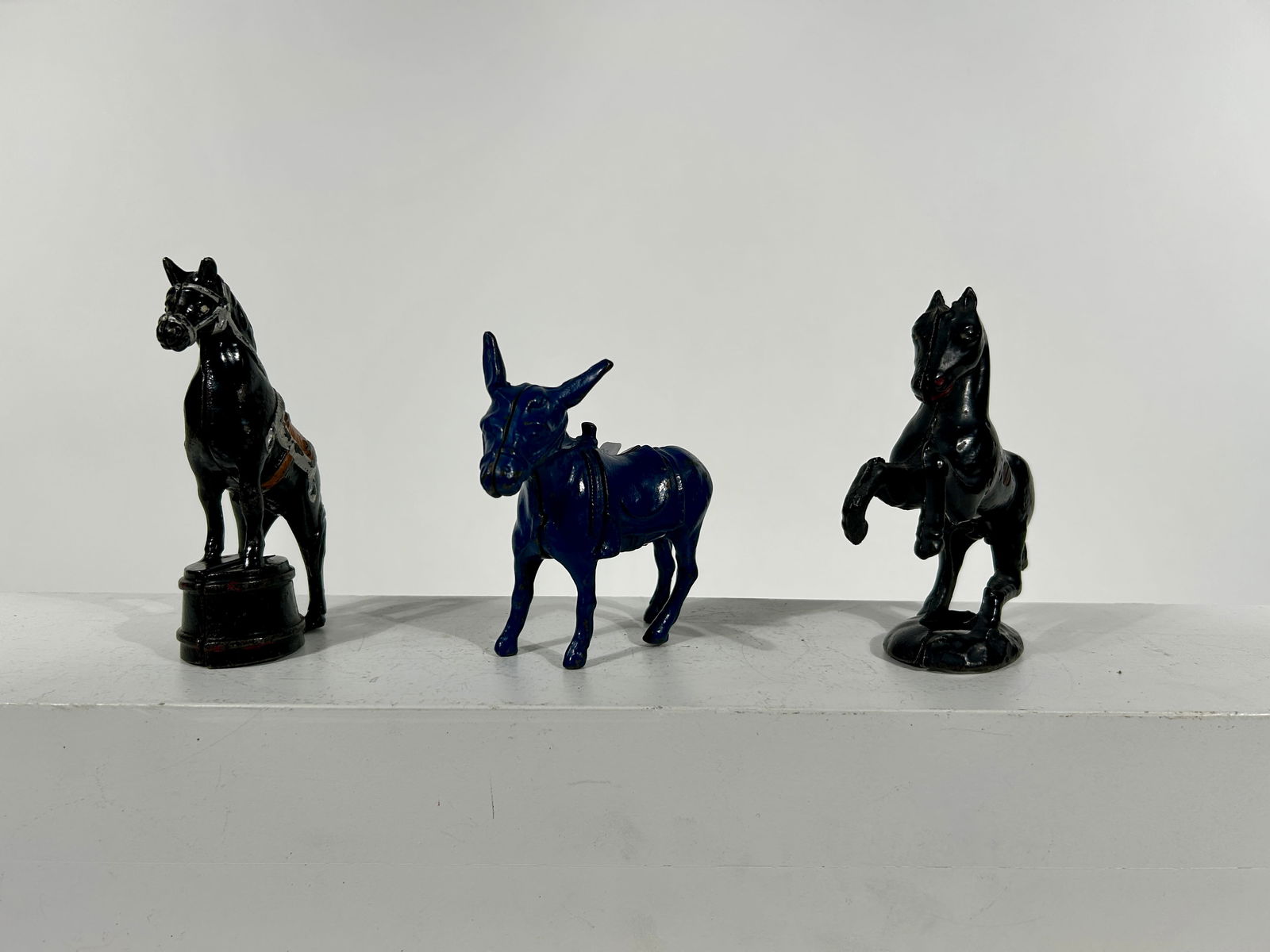 Three Equine Themed Cast Iron Banks: American 1920 - 4 1/4" to 5 1/4" Tall