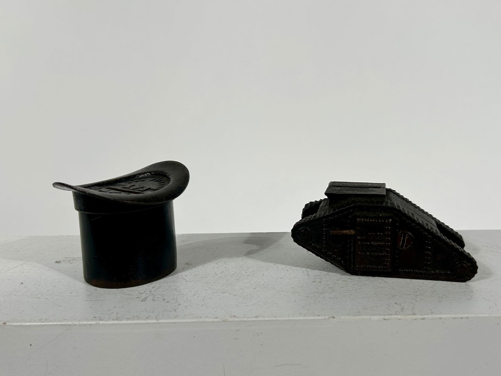 Top Hat and Tank Banks - Cast Iron: American 1890/1920 - Larger one 3 3/4" L x 2"T x 2 1/4" D